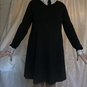 Black dress with white lace collar and cuffs